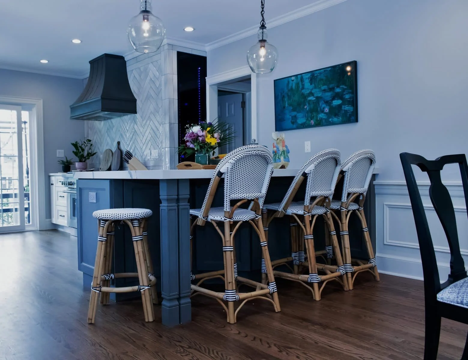 Kitchen island with seating and herringbone backsplash in Mt. Vernon home
