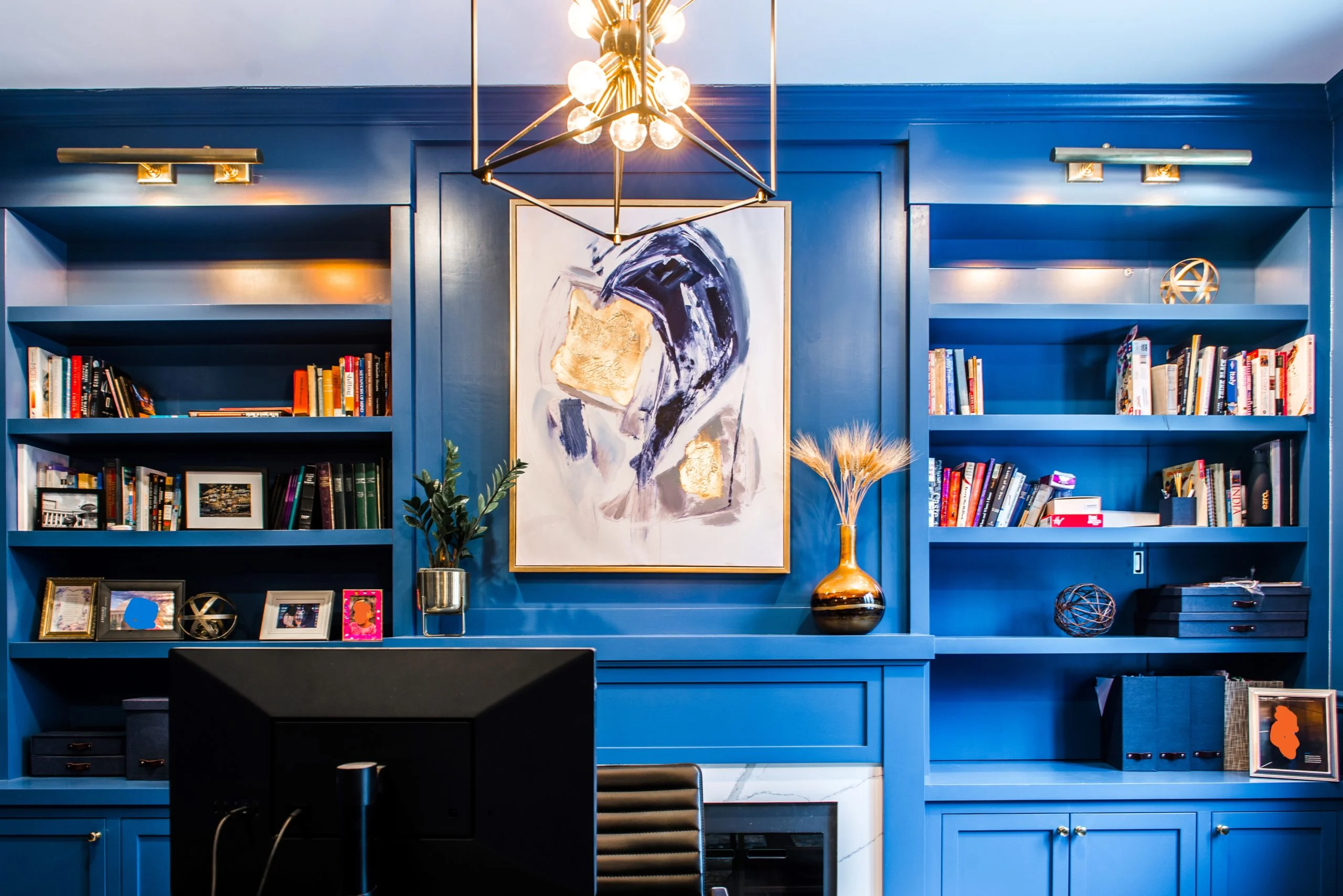 Built in office furniture painted blue with fireplace