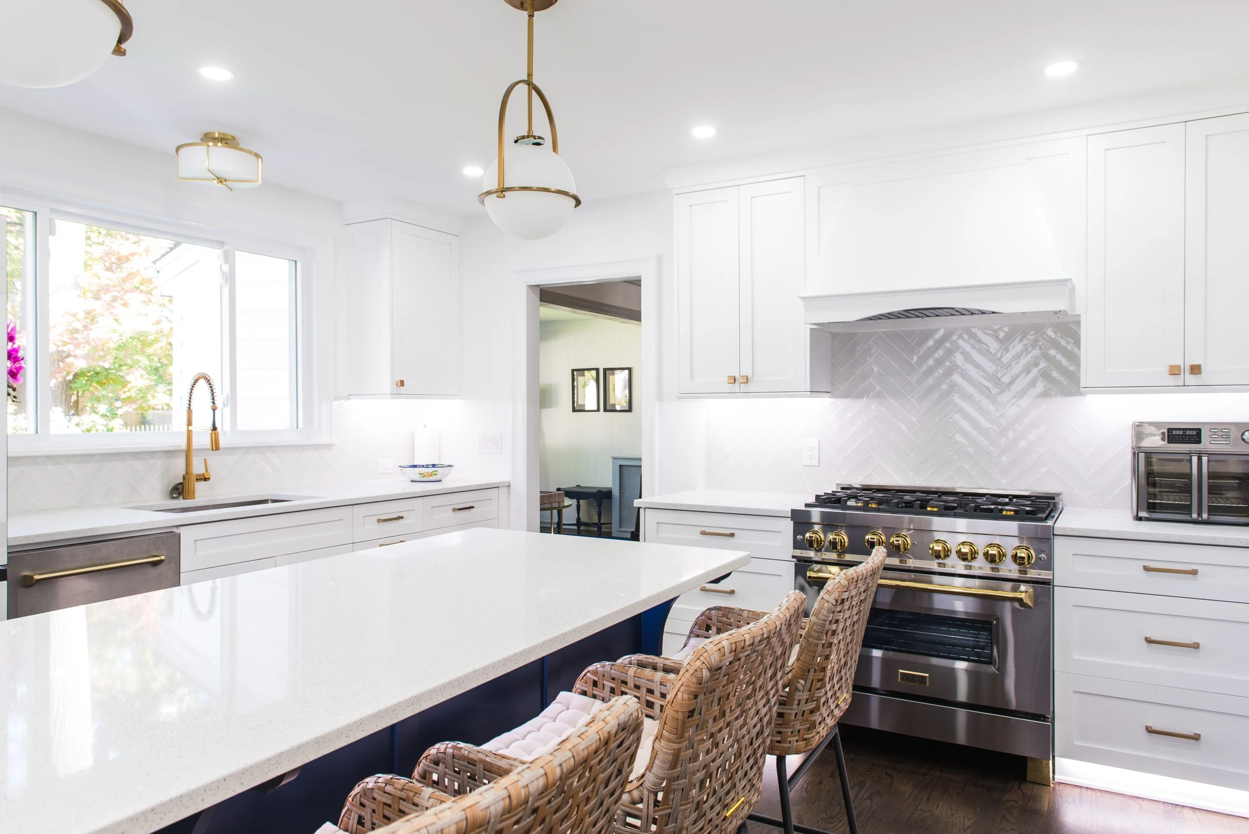 Blue and white cabinets with large island