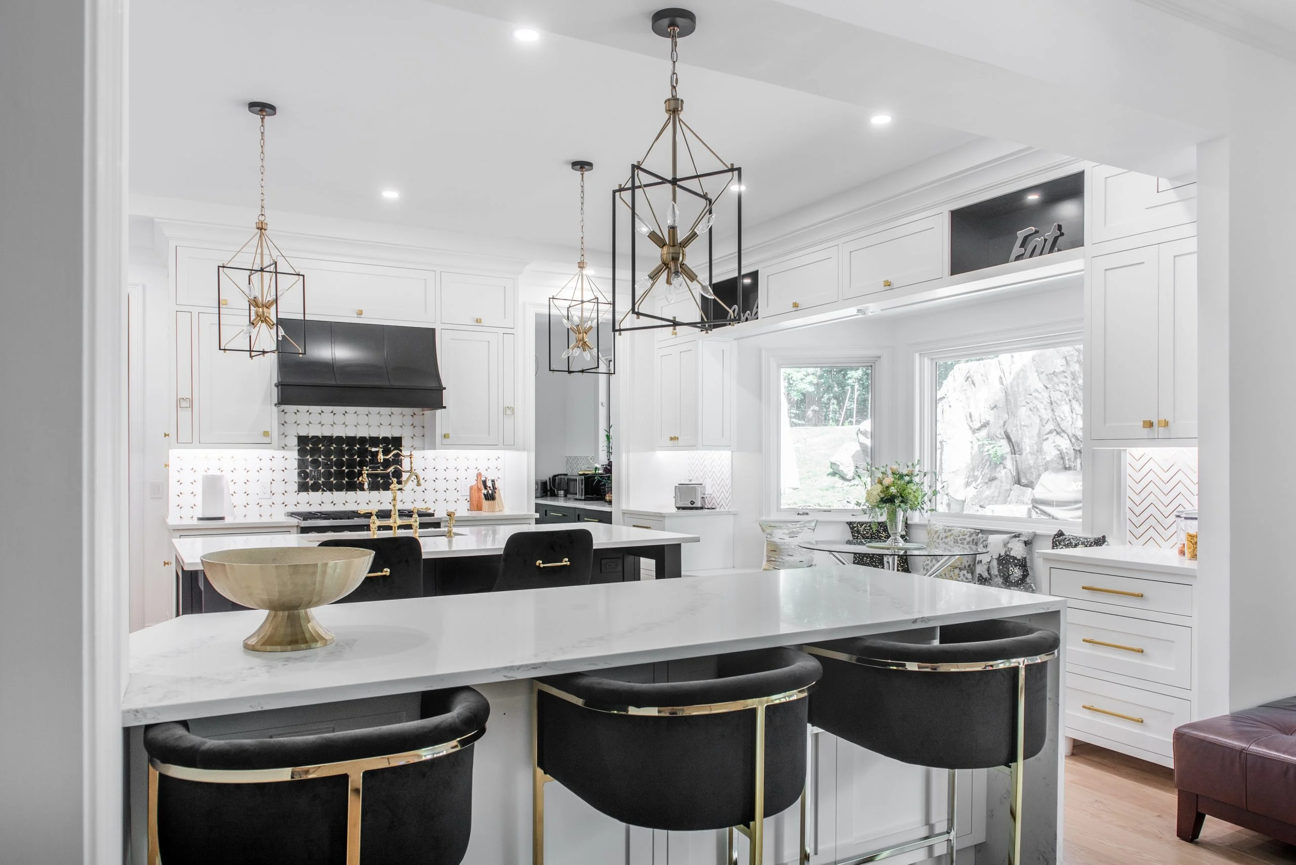 Open kitchen remodel in Rye NY with island seating and gold fixtures