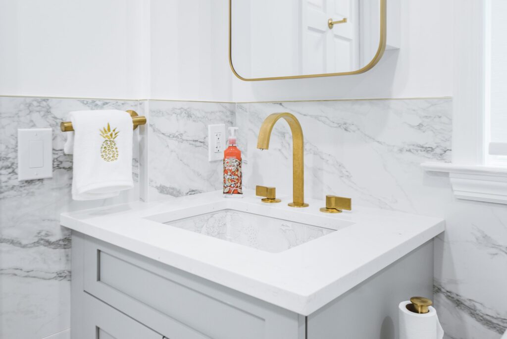 RAJ_240608-93 Marble tile with brass hardware bathroom remodel