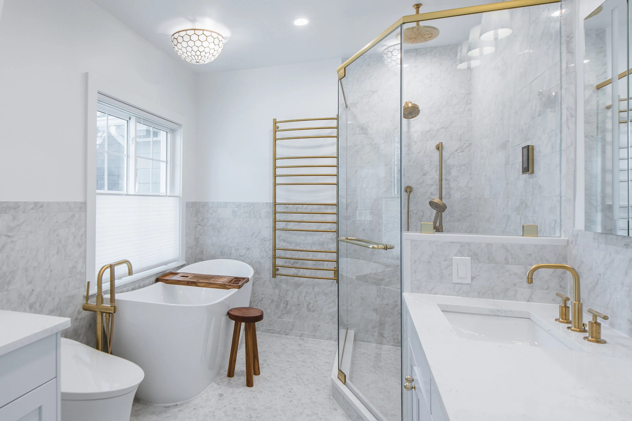 luxury bathroom remodel with freestanding tub and brass fixtures New Rochelle NY