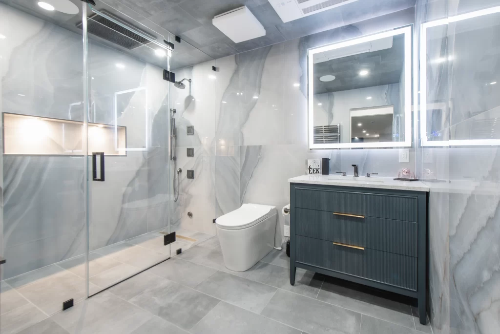 Spa-style basement bathroom with steam shower and heated floors.