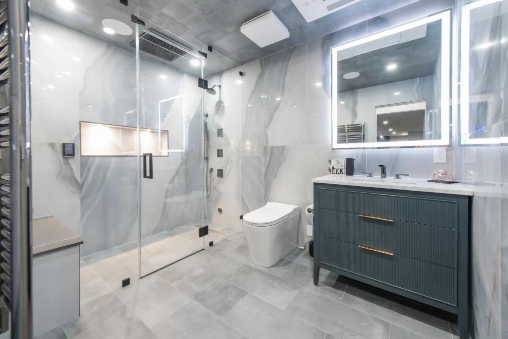 Spa-style basement bathroom with steam shower and heated floors.