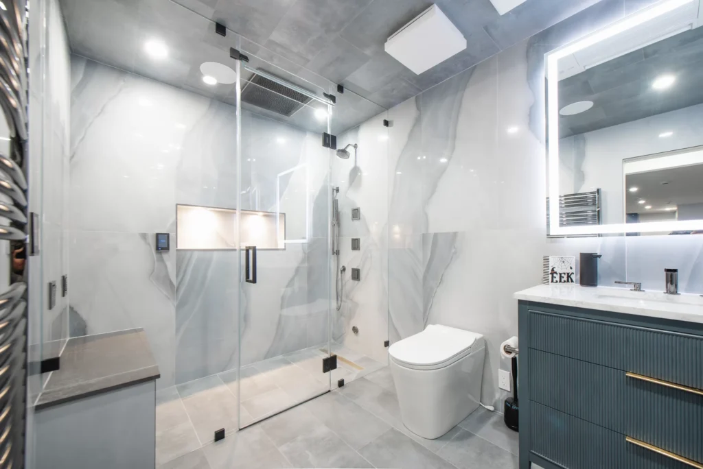 basement-bathroom-renovation-westchester Spa-style basement bathroom with steam shower and heated floors.